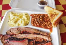 Discover Your Next Adventure in DeSoto Parish Shank Cat's BBQ rib platter with sausage, mashed potatoes, baked beans, and toast in DeSoto
