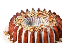 Tired of Cooking? Try Out These Southern Food Deliveries for the Holidays fluted bundt cake with white icing dripping into the corners on a white cake stand with a gold base