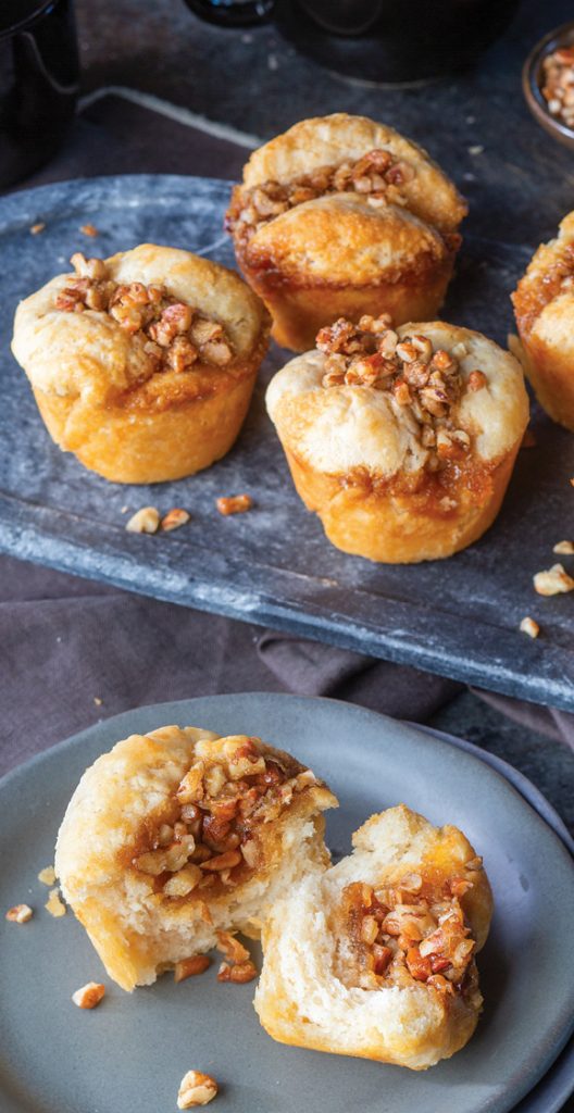 Caramel Pecan Biscuits on cooling rack and plate.