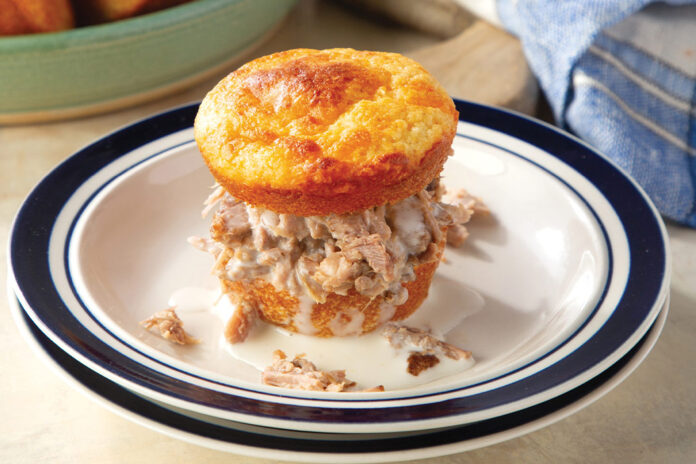 Brenda Gantt’s Muffin Sliders are full of Southern flair thanks to the cornbread muffins, Boston butt, and Alabama white barbecue sauce.