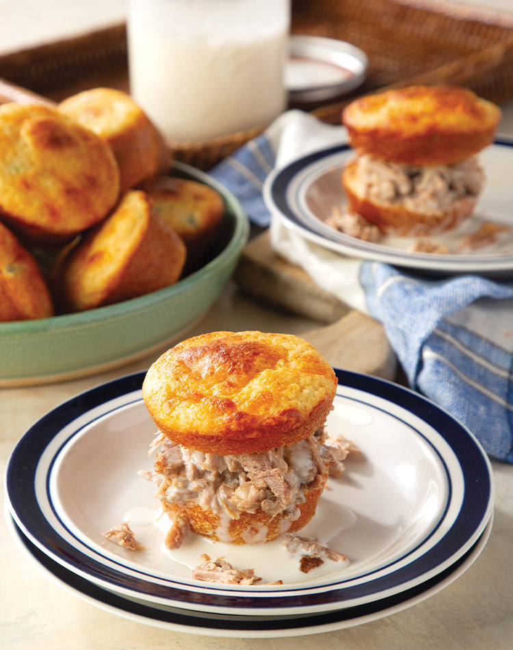 Brenda Gantt’s Muffin Sliders are full of Southern flair thanks to the cornbread muffins, Boston butt, and Alabama white barbecue sauce.