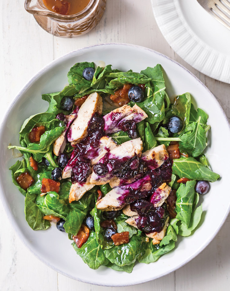 Try our Blueberry Maple Chicken Kale Salad with Warm Bacon Vinaigrette. Seasonal blueberries dapple with maple syrup across browned, juicy chicken breasts. Delicate baby kale stands up brilliantly to bacon vinaigrette.