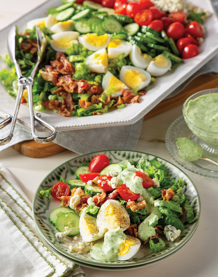 Our Green Goddess Cobb Salad takes the classic up a notch with a creamy herb dressing packed with flavor. Think tender chicken, crisp romaine, juicy tomatoes, crumbled blue cheese, and all the fixings, bathed in a vibrant green goddess dressing.