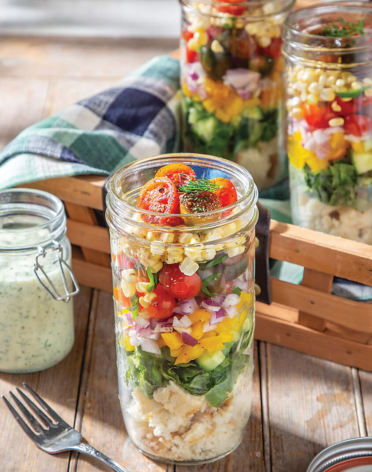 Our Mason Jar Cornbread Salad with Buttermilk Vinaigrette is a symphony of sweet cornbread crumbles, creamy black beans, juicy tomatoes, and crisp veggies, all drizzled with a tangy buttermilk dressing.