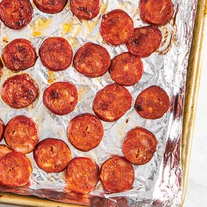 Sausage on aluminum foil covered sheet pan