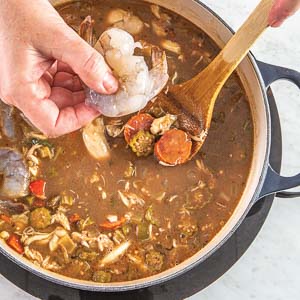 Adding shrimp to gumbo