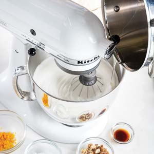 Pouring sugar syrup into egg white mixture