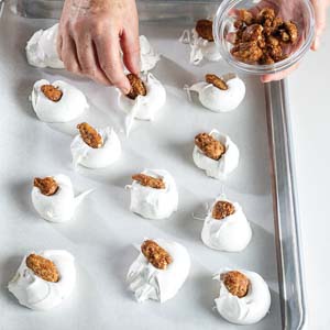 Topping candy with pecans