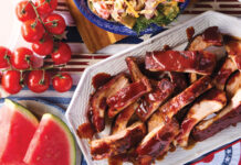 Smoked Baby Back Ribs Smoked baby back ribs covered in barbecue sauce.