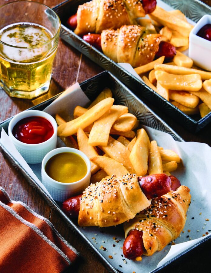 jumbo pigs in a blanket with hot dogs and crescent rolls paired with fries